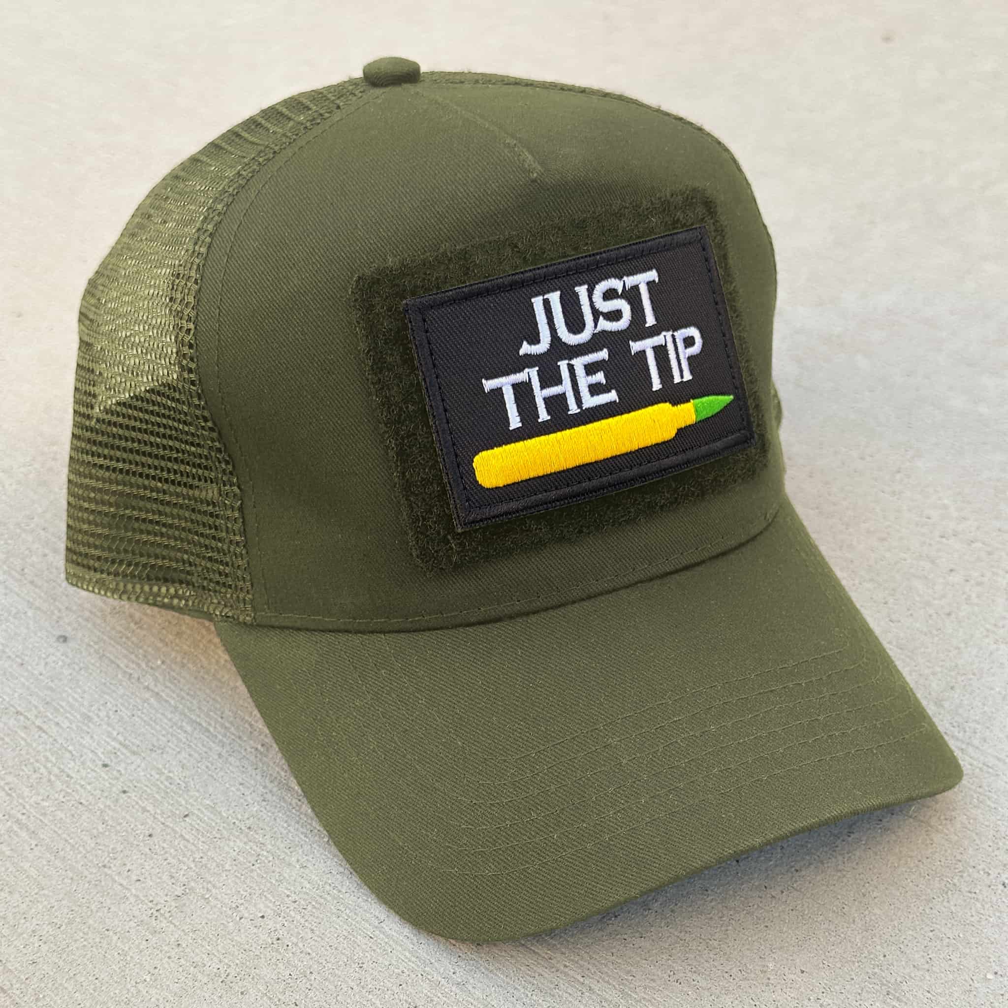 The Blank Canvas Snapback cap in military green color with the 'Just the Tip' patch attached