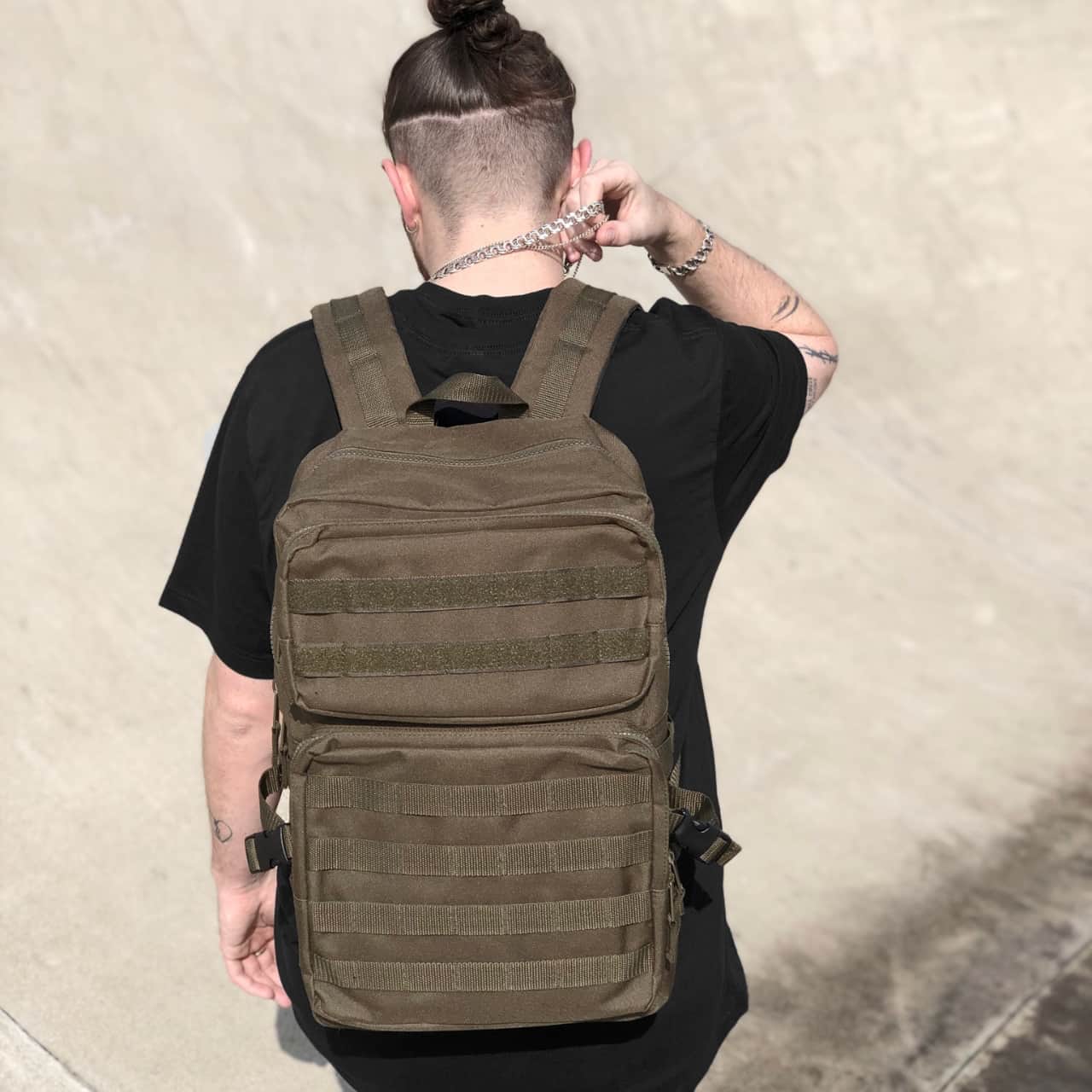 Model wearing the Tactical Bag with MOLLE and the hook-and-loop system