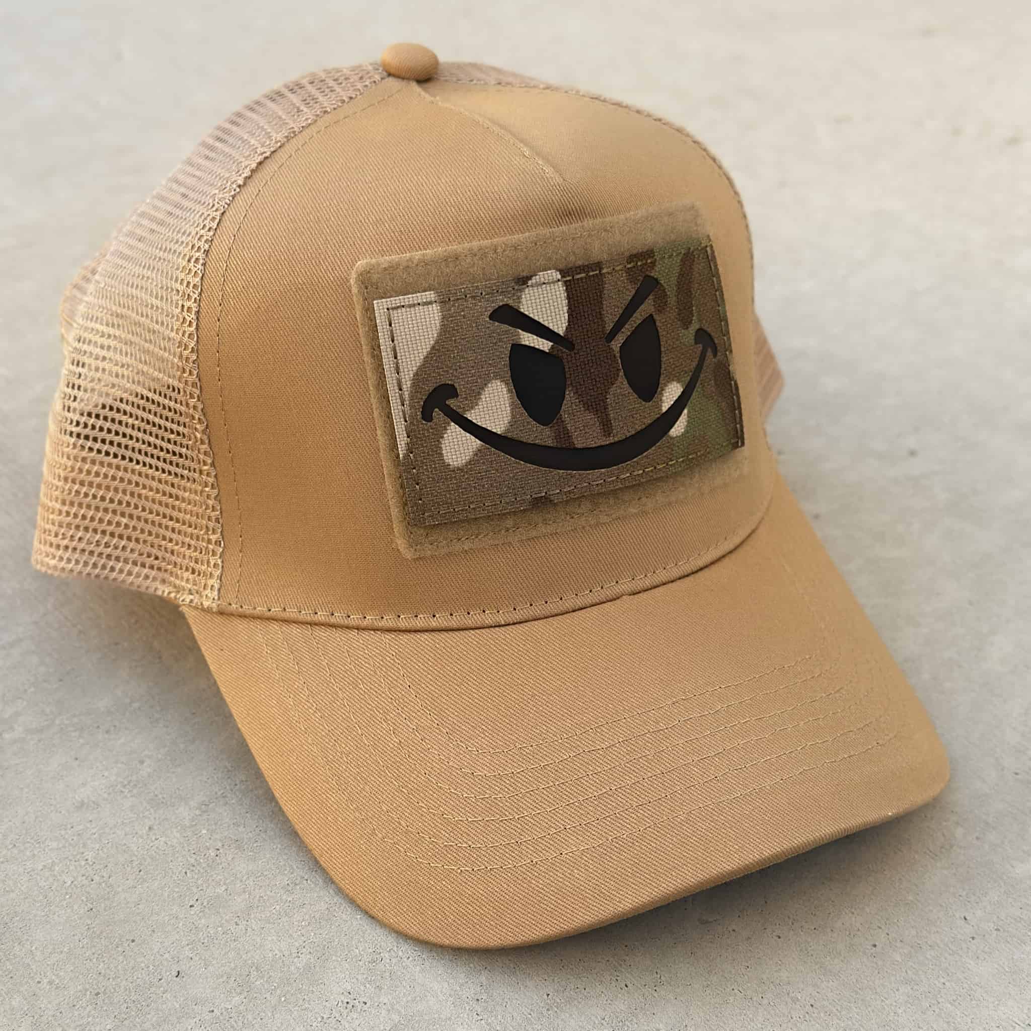 The Smiley cap in desert sand color with camo military style smiley patch
